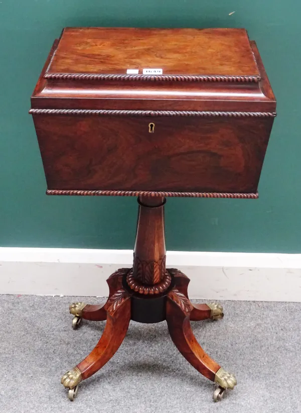A William IV rosewood teapoy, with four lidded canisters, on turned column and four downswept supports, 41cm wide x 77cm high.