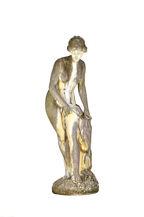 A reconstituted marble figure of a scantily clad Venus in a standing pose, 166cm high. Illustrated