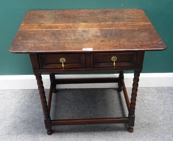 A made-up 17th century and later oak side table, the single frieze drawer on bobbin turned supports, united by perimeter stretcher, 83cm wide x 75cm h