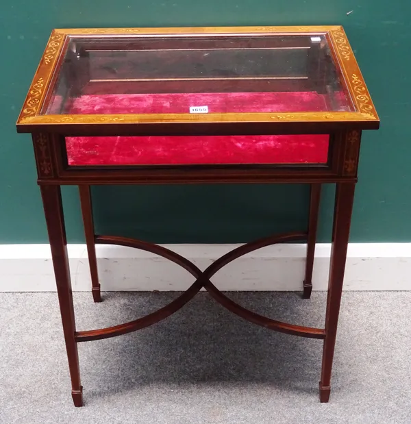 An Edwardian inlaid mahogany bijouterie table with rectangular lift-top on tapering square supports, united by 'X' frame stretcher, 62cm wide x 73cm h