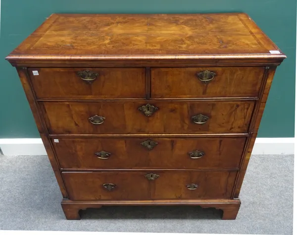 An early 18th century and later figured walnut chest of two short and three long graduated drawers, on bracket feet, 97cm wide x 98cm high x 53cm deep