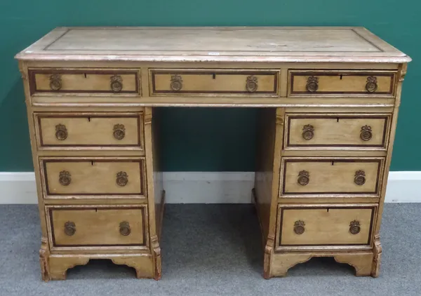 A 19th century scumble painted pine desk, with nine drawers about the knee, 123cm wide x 80cm high x 55cm deep.