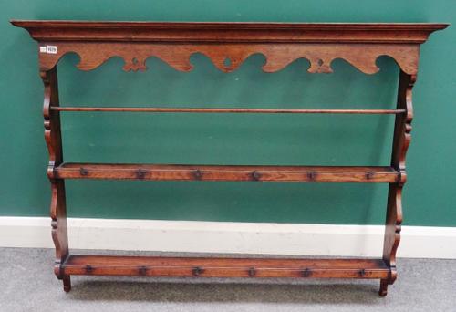 An 18th century oak open two tier delft rack, with shaped frieze, 134cm wide x 100cm high.
