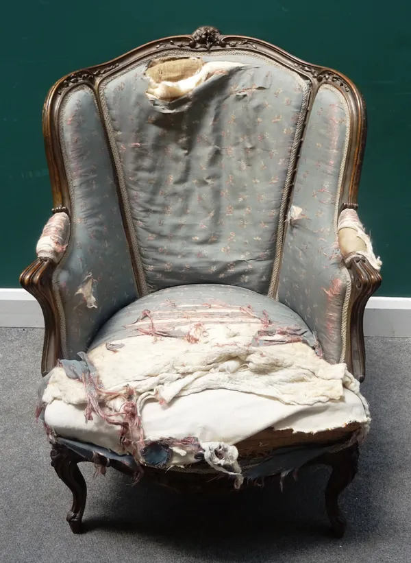 A Louis XV style tub back armchair, with serpentine seat and cabriole supports, 71cm wide x 95cm high.