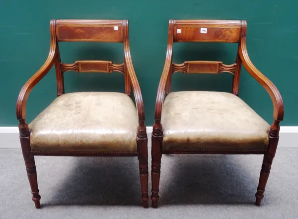 A pair of George IV brass inlaid mahogany carver chairs, with tablet waist rail, on turned supports, 56cm wide x 83cm high, (2).