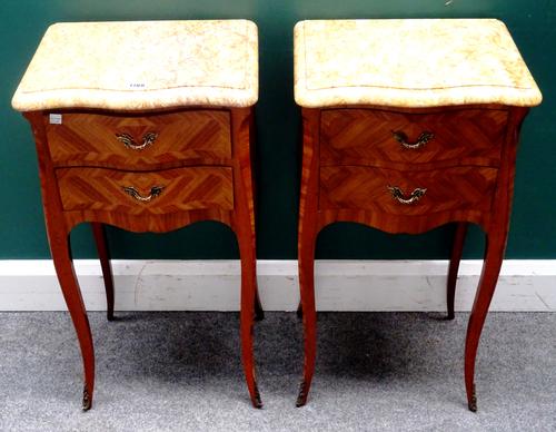 A pair of Louis XV style bedside tables, each with serpentine marble top over a kingwood two drawer base, on cabriole supports, 39cm wide x 74cm high