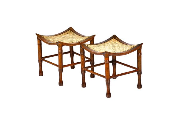 A pair of Thebes stools, each with dished beech framed square top on turned supports united by perimeter stretcher, 37cm wide x 38cm high, (2). Illust