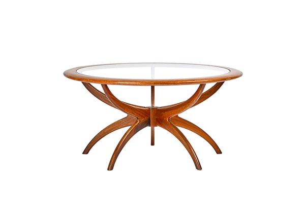 G Plan; a mid-20th century teak framed Astro occasional table, with circular glass inset top, 91cm deep x 46cm high. Illustrated