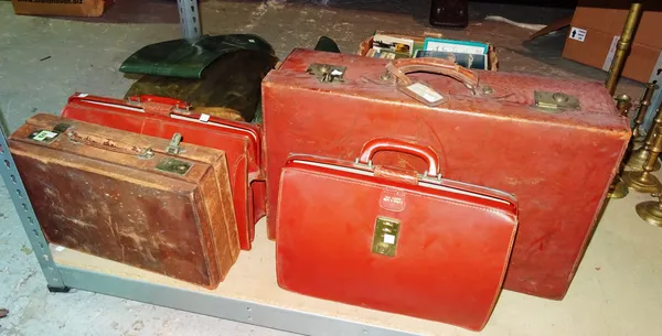 An early 20th century brown faux leather suitcase and three similar cases, (4).    S3B