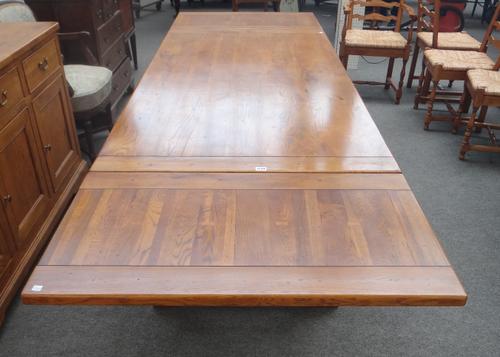 Willis & Gambier; a 17th century style oak draw leaf dining table, on baluster turned supports united by 'X' frame stretcher, 91cm wide x 183cm long 2