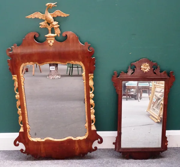 A George III fret cut parcel gilt walnut framed pier glass, with Ho-ho bird surmount, 56cm wide x 111cm high, together with a similar smaller mirror,