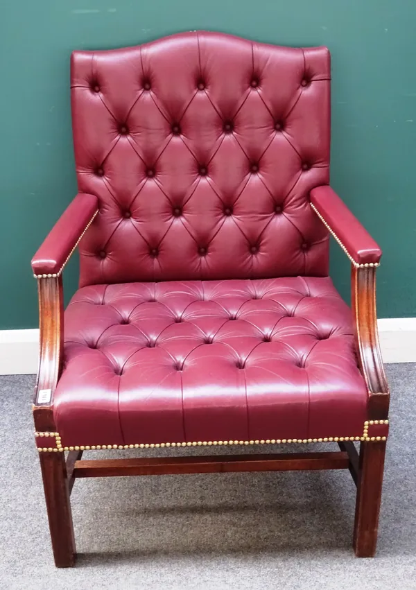A mahogany framed Gainsborough chair in the George III style, with brass studded rouge leather upholstery, 72cm wide x 101cm high.