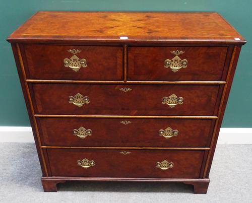An early 18th century style figured walnut chest of two short and three long graduated drawers, on bracket feet, 104cm wide x 99cm high x 50cm deep.