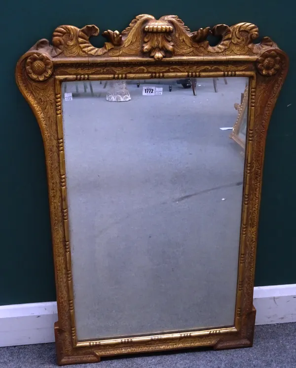 A George I style gilt framed mirror, with shaped and moulded crest rail above rectangular mirror plate, 69cm wide x 102cm high.