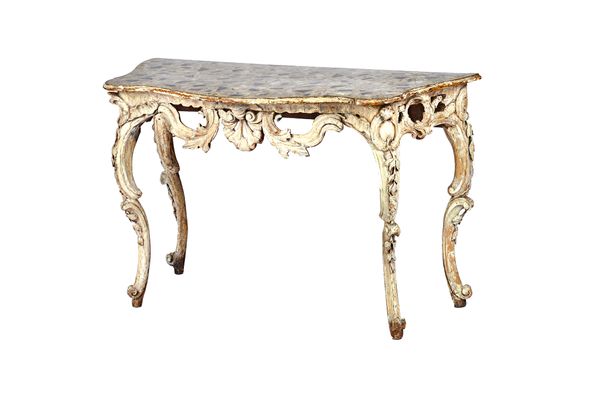 An 18th century Italian console table, the later serpentine painted faux marble top over a whitewashed carved and pierced base, on opposing 'C' scroll