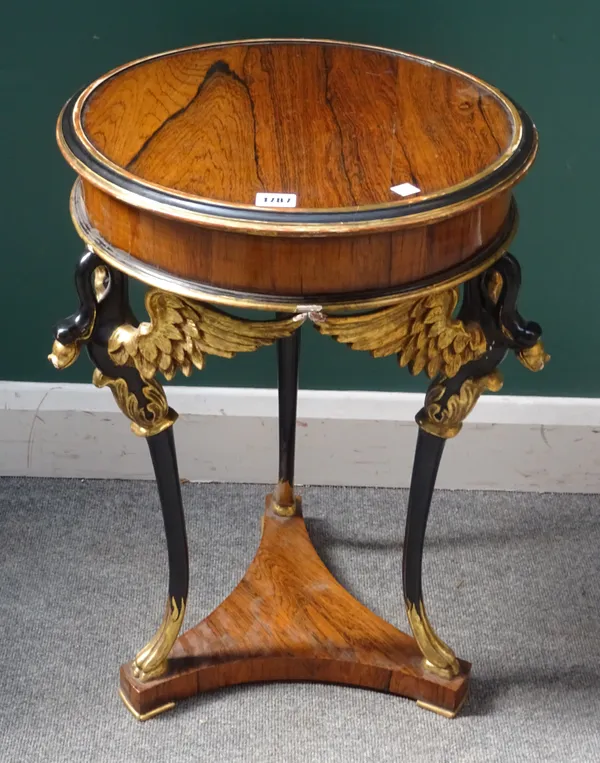 An Empire Revival rosewood ebonised and parcel gilt circular gueridon, on three winged beast supports, 43cm diameter x 65cm high.  4187