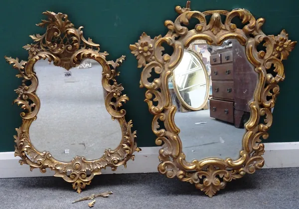 A 19th century Rococo revival gilt framed mirror, of shaped outline, 55cm wide x 86cm high, together with another similar, 72cm wide x 88cm high, (a.f