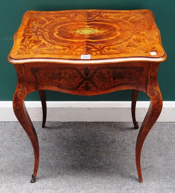 A Napoleon III marquetry inlaid gilt metal mounted kingwood work table, the serpentine lift top revealing a fitted interior, above a pull-out wool box