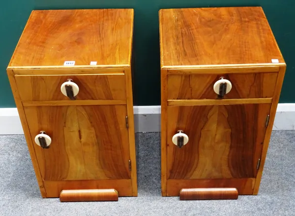 A pair of mid-20th century walnut and beech bedside tables, each with single drawer and cupboard, 38cm wide x 62cm high x 38cm deep, (2).