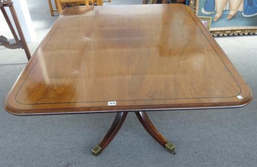 A George III mahogany breakfast table, the rectangular snap top on turned column and four downswept supports, 106cm wide x 137cm x 75cm high.