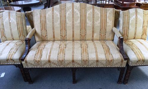 A mid-18th century style mahogany framed salon suite, to comprise; a sofa with humpback and open arms 144cm wide x 110cm high, and six matching side c