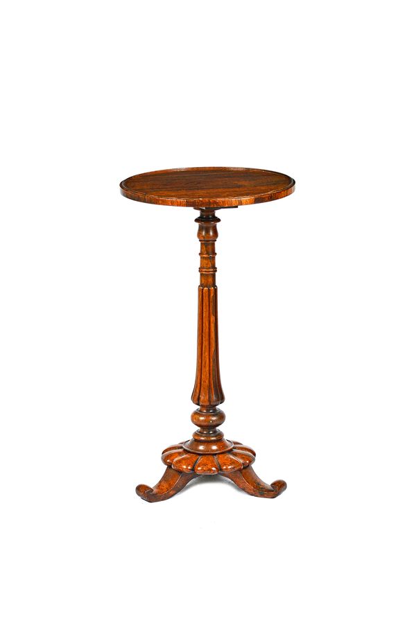 A William IV rosewood occasional table, the circular top on a reeded baluster column and three splayed supports, the top 40cm diameter x 73cm high. Il