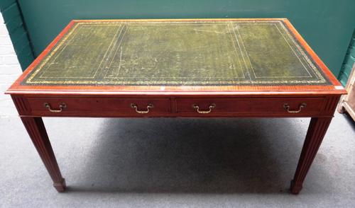 Maple; a mid-18th century style mahogany writing desk, the gilt tooled green leather top over a pair of frieze drawers on tapering square supports, 15