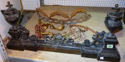 An early 20th century bronze fire curb with urn and shell decoration, a pair of gilt acanthus moulded wall brackets and a bronze canopy with floral an