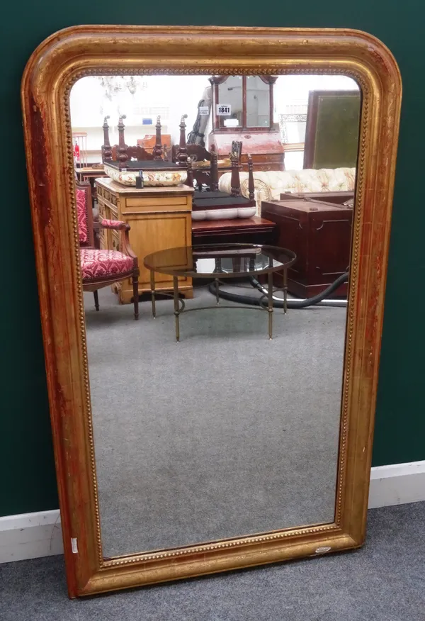 A 19th century gilt framed arch top overmantel mirror, with floral decorated frame, 84cm wide x 139cm high.