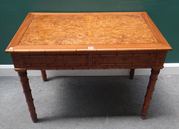 A 19th century French faux bamboo pollard oak two drawer writing table, on turned supports, 102cm wide x 62cm deep x 73cm high.