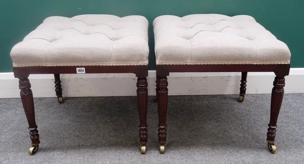 A pair of square footstools, each with button upholstered over-stuffed seats, on 19th century fluted mahogany supports, 50cm wide x 50cm high, (2).