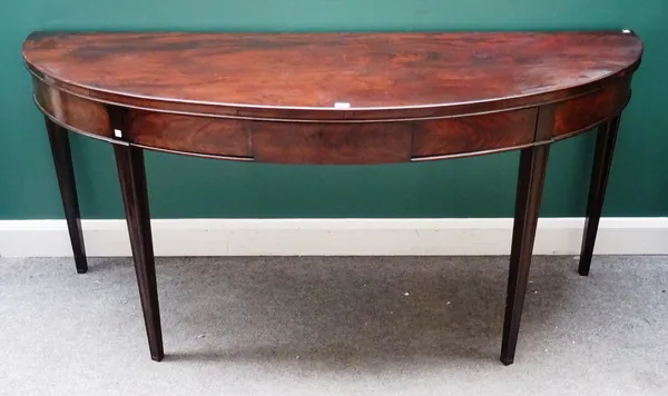 A George III style mahogany semi-elliptic serving table, with single frieze drawer on tapering square supports, 185cm wide x 85cm high x 67cm deep.