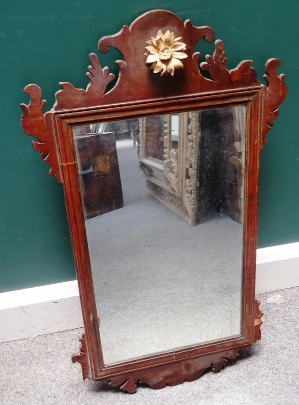 A George III walnut fret carved pier glass, 46cm wide x 90cm high, together with an early 19th century galleried single door night stand, on tapering