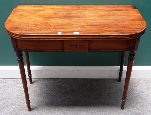 A Regency mahogany tea table, the 'D' shaped top on turned tapering supports, 91cm wide x 76cm high x 45cm deep.