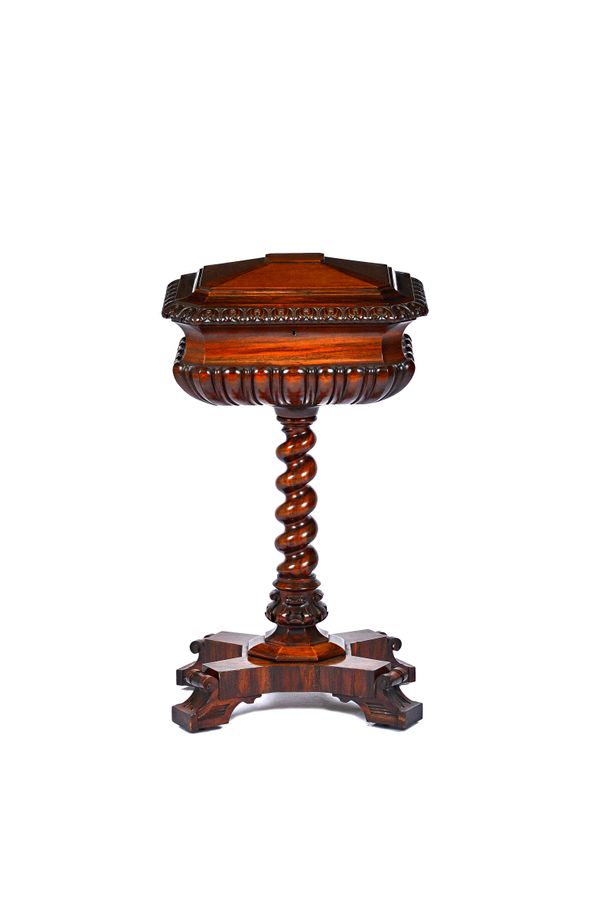 A late William IV mahogany and goncalo alves teapoy, with a lidded four canister interior, on barleytwist column and quatrefoil platform, 49cm wide x