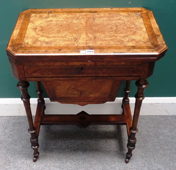 A Victorian figured walnut games/work table, the foldover rectangular top over fitted drawer and pull-out wool box, on turned supports, 64cm wide x 74