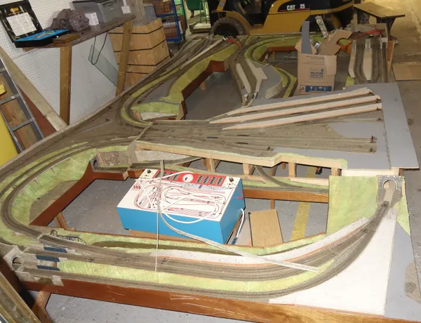 A large scratch built oo-gauge train track and accesories, including no locomotives. BAY4