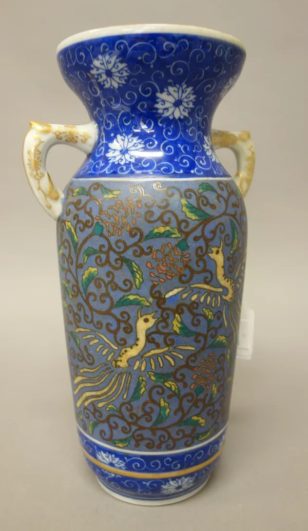 A Japanese porcelain two-handled cylindrical vase, 20th century, decorated in cloisonné style with a central band of ho-ho birds amongst branches, bet
