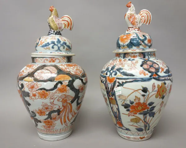 Two Japanese Imari vases and covers, Edo period, circa 1700, each of ovoid form, one painted with birds in branches, the other with flower panels, the