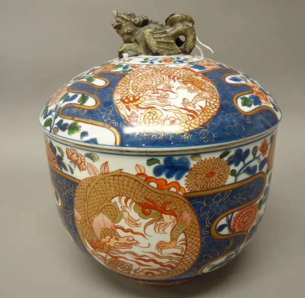 An Imari type circular tureen and cover, probably Samson, late 19th century, painted with coiled dragon roundels against a ground filled with chrysant