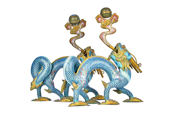 A pair of Chinese cloisonné and gilt-metal models of dragons, each beast in striding pose with detachable head turned back, its open mouth issuing a f