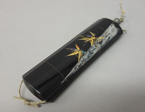 A Japanese four-case lacquer inro, Edo period, 18th century, decorated in Ritsuo style in gold, red, silver and black hiramaki-e, takamaki-e and inlay