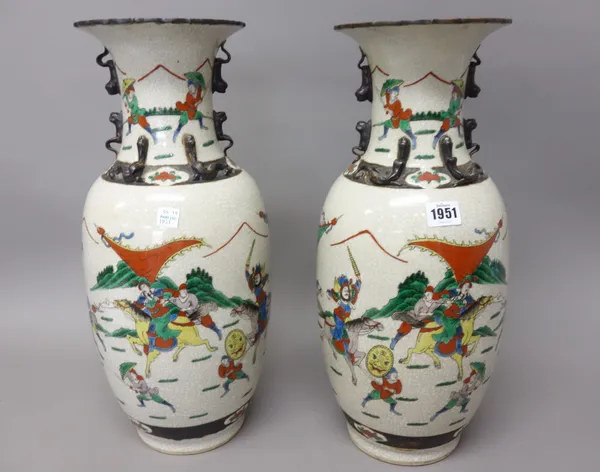 A pair of Chinese crackleware baluster vases, each painted with a battle scene in a famille-verte palette, 46cm. high (2).