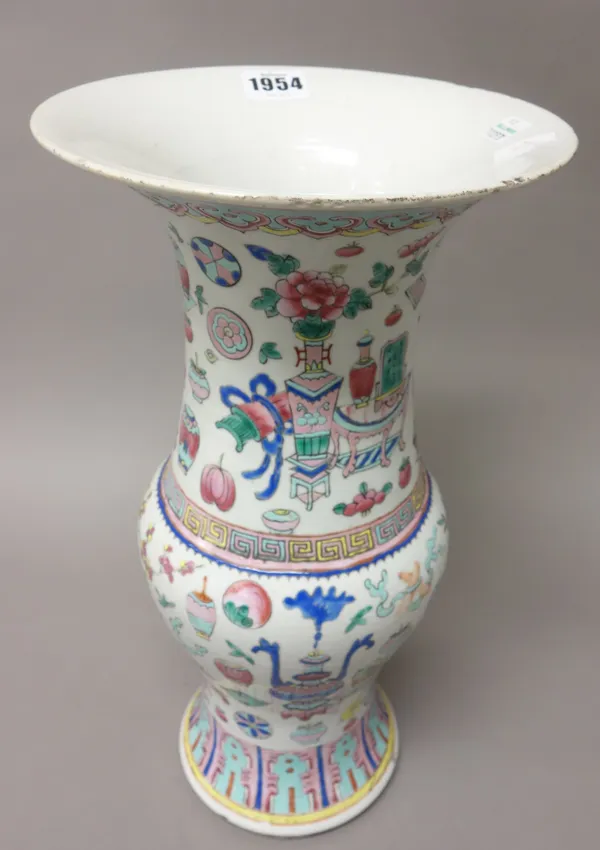 A Chinese famille-rose slender baluster vase, early 20th century, painted with Buddhist emblems beneath a ruyi-head border, 38cm. high.