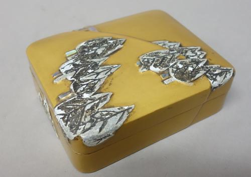 A Japanese lacquer kogo (incense box), Edo period, 19th century, decorated with mother-of-pearl and lead inlay with a pine forest on a hillside, nashi