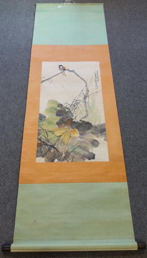 A Chinese scroll picture bearing the signature Zhao Shaoang, 20th century, depicting a bird in a branch above flowers, signed and with two red seals,