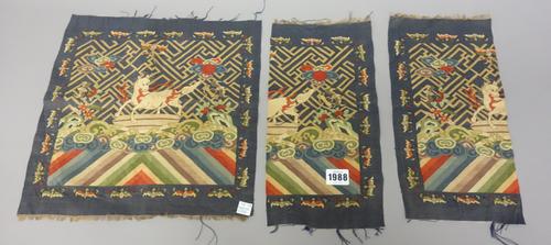 Two Chinese embroidered rank badges, 19th century, each depicting a white horse on a rock above foaming waves, against a deep blue ground with gold wa