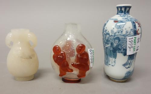 Three Chinese snuff bottles, 20th century, comprising; a jade bottle, carved on one side with a figure beside a tree, the reverse with calligraphy, 5.