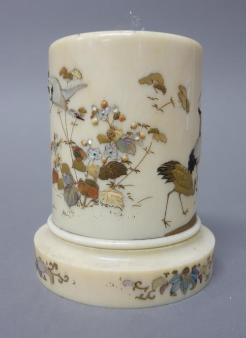 A Japanese Shibayama style ivory cylindrical vase, Meiji period, inlaid in mother-of pearl and other materials and gilt with two wading birds amongst