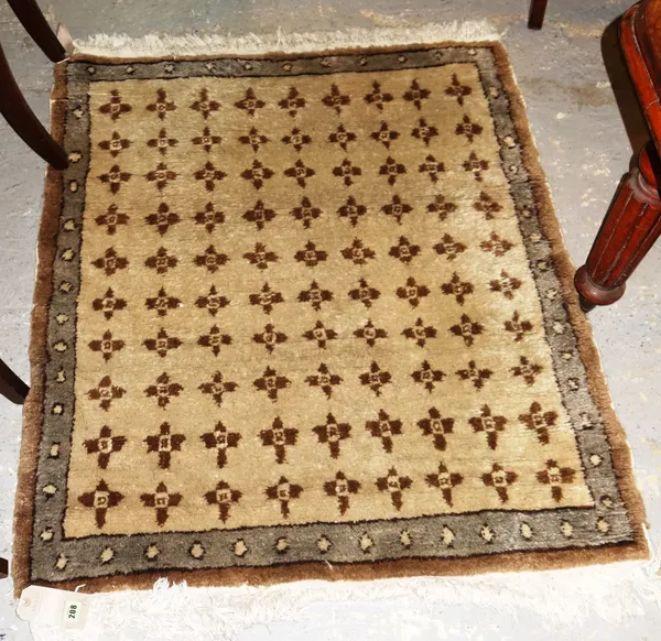 A pair of Egyptian grey/brown rugs, each approximately 130cm x 106cm, (2).  H6